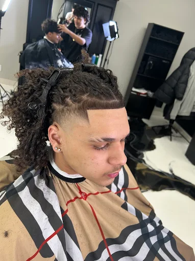 Curly top with a burst fade and defined line-up