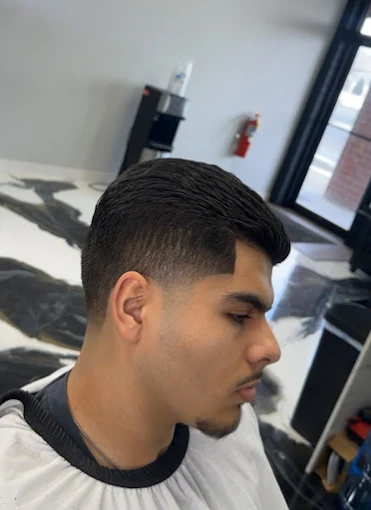 Fresh mid fade with a sharp line-up detail