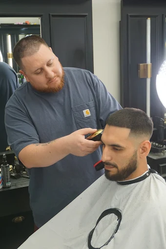 Textured fade with styling and finishing product